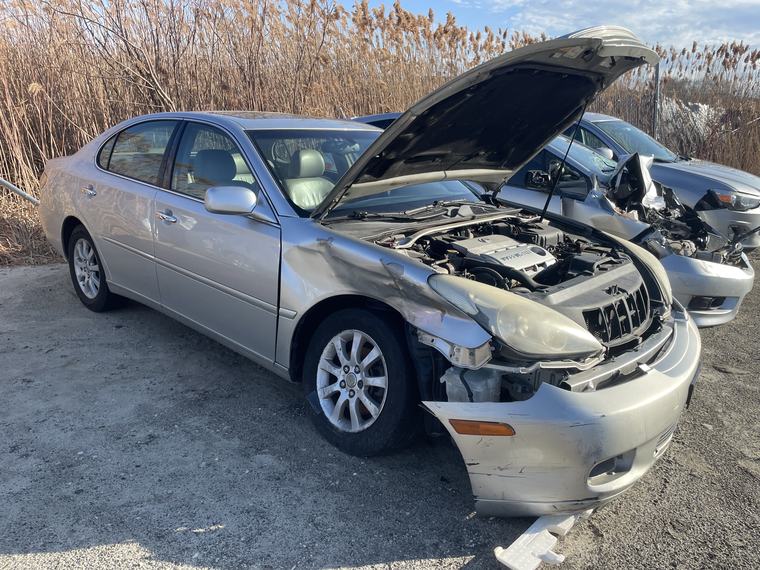 Silver 2004 Lexus ES330 with collision damage, bought for cash