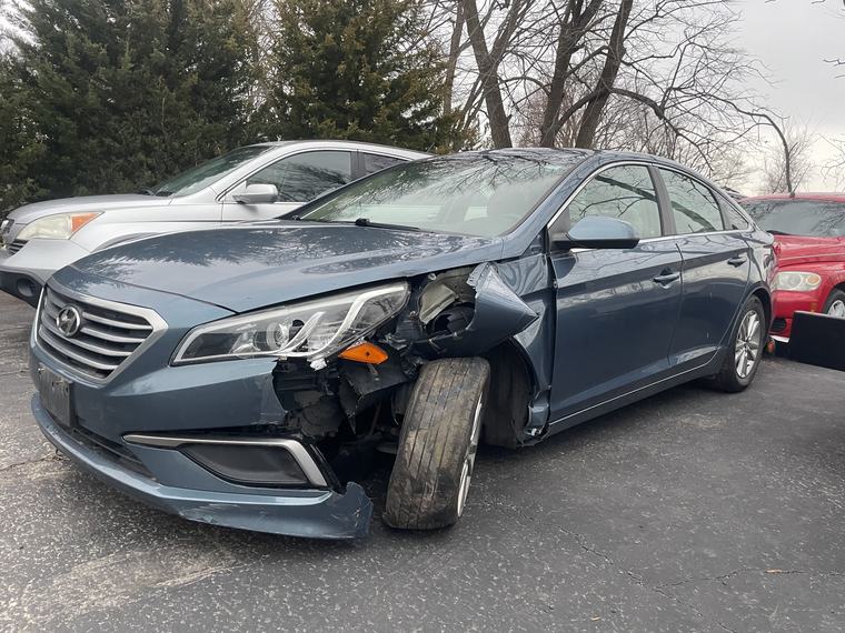 2016 Hyundai Sonata with collision damage, bought for cash